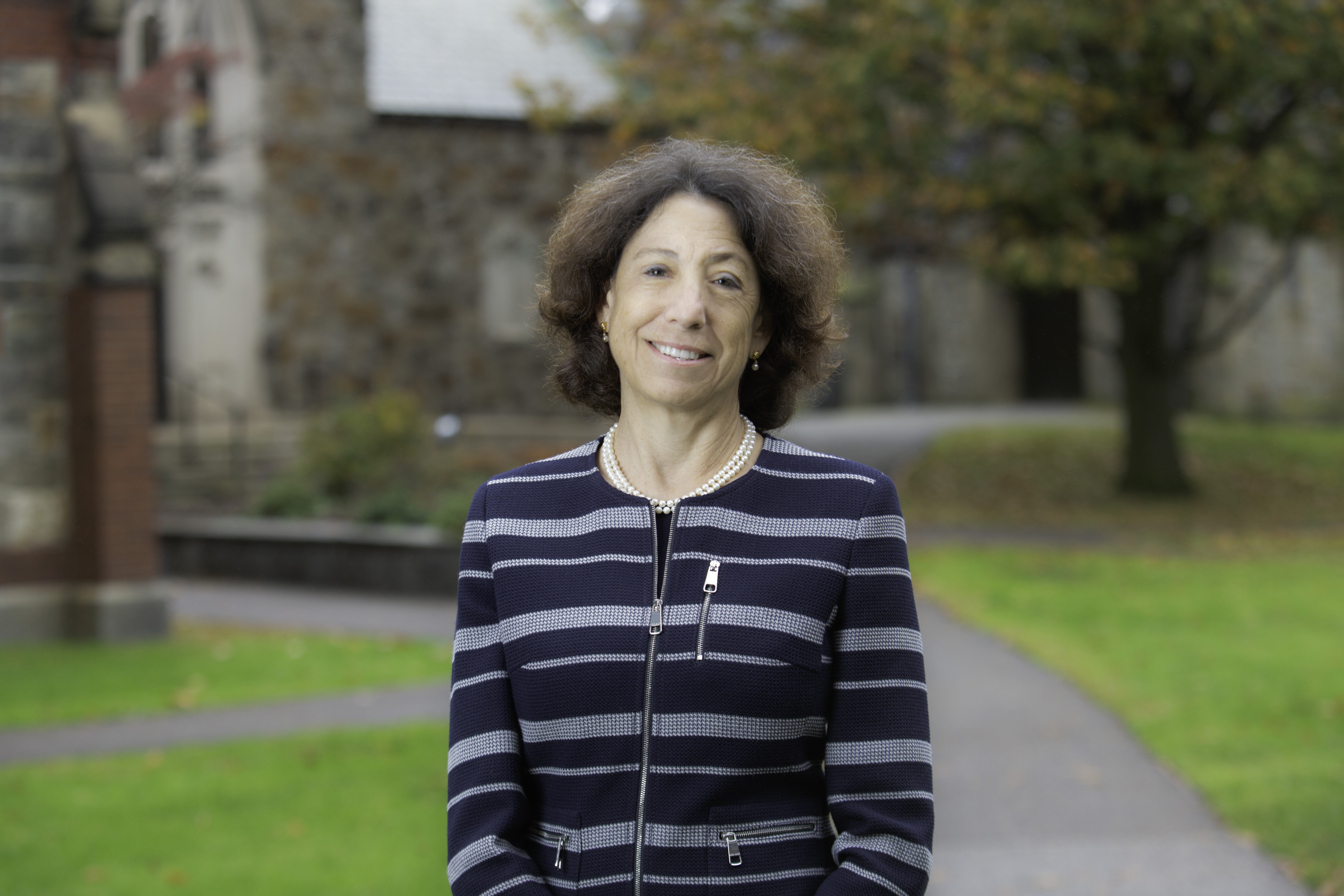 President Steinmayer wearing a striped blazer on Brattle Campus